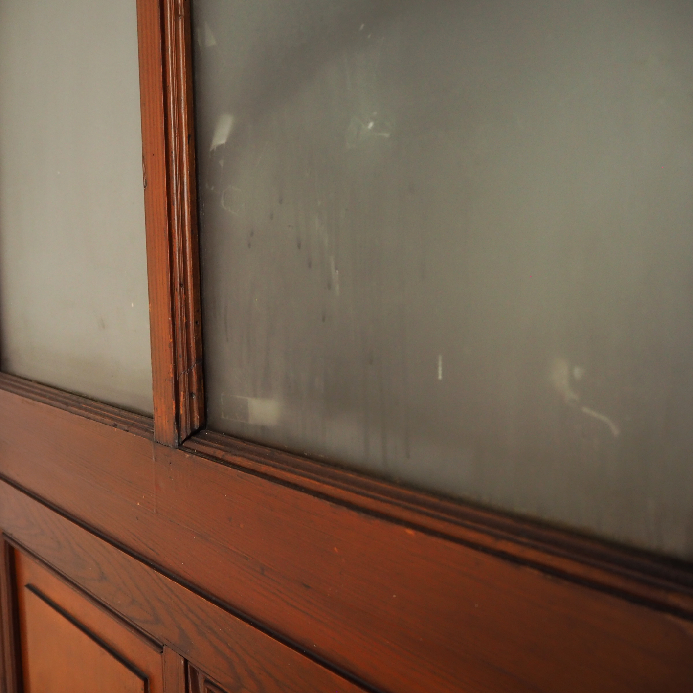 Solid wooden door with opaque glass panels