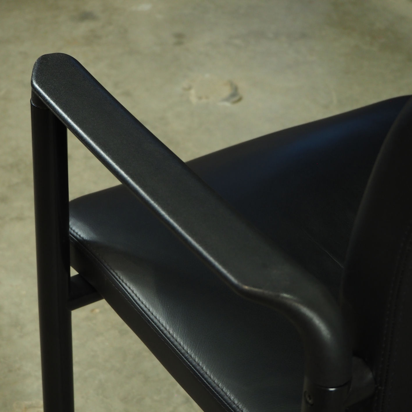 Black leather armchair by Martin Stoll