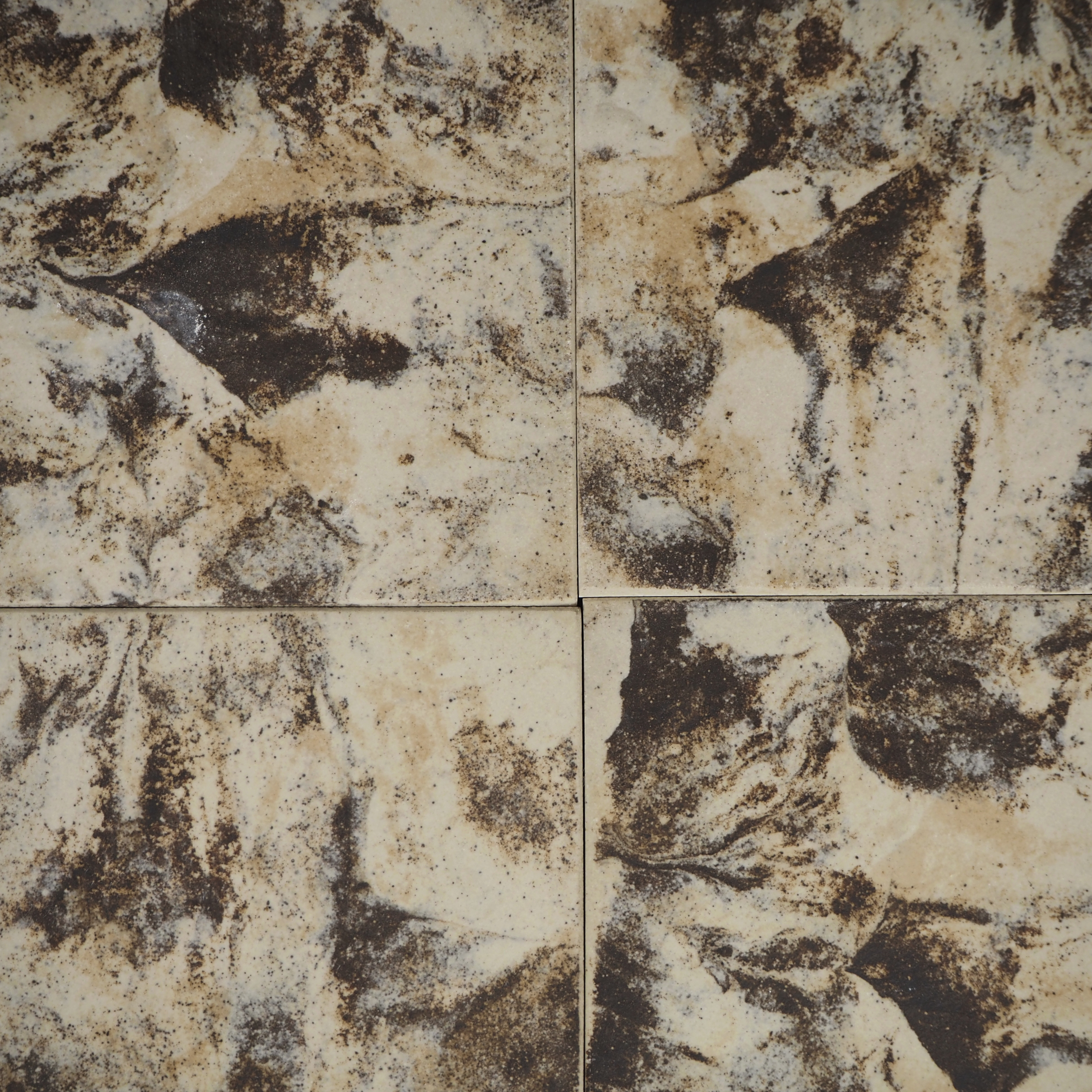 Flamed dark brown and beige ceramic tiles by Royal Mosa (100 x 100 mm)