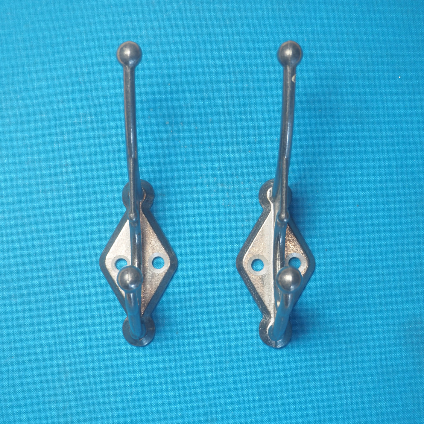 Pair of coat hooks in cast aluminium