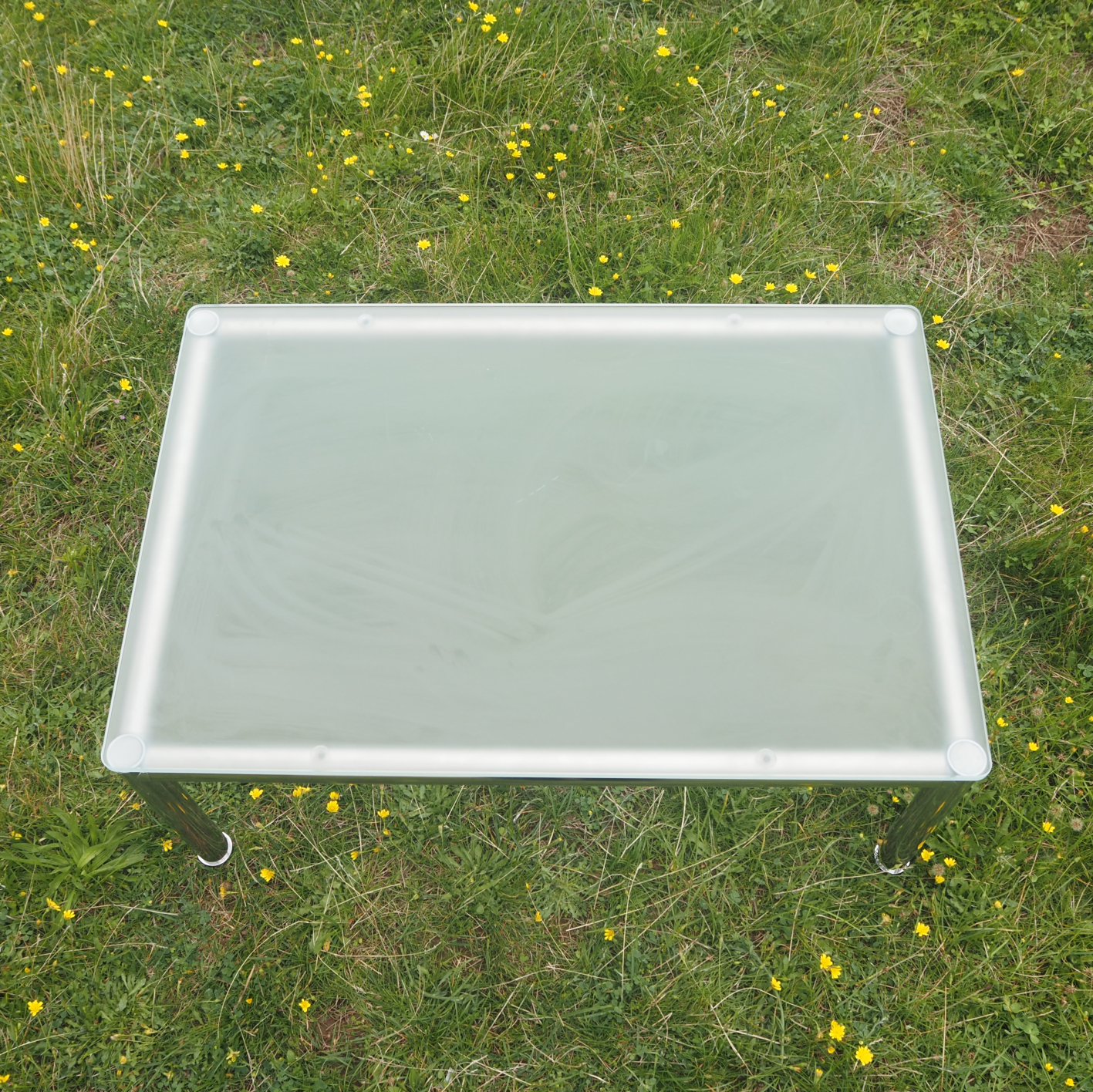 Coffee table with glass top and chromed aluminium base