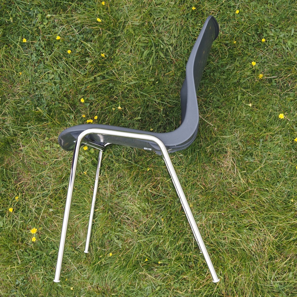 Stackable chair with anthracite polypropylene shell and tubular steel legs