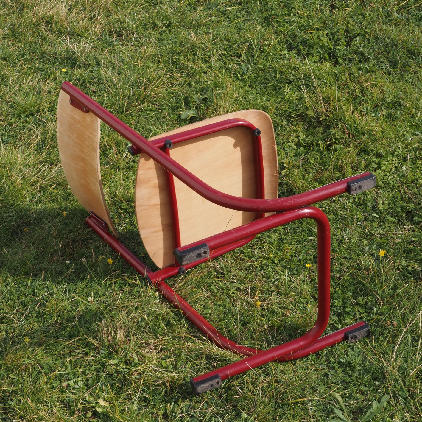 Cantilever chair with plywood seat and steel legs