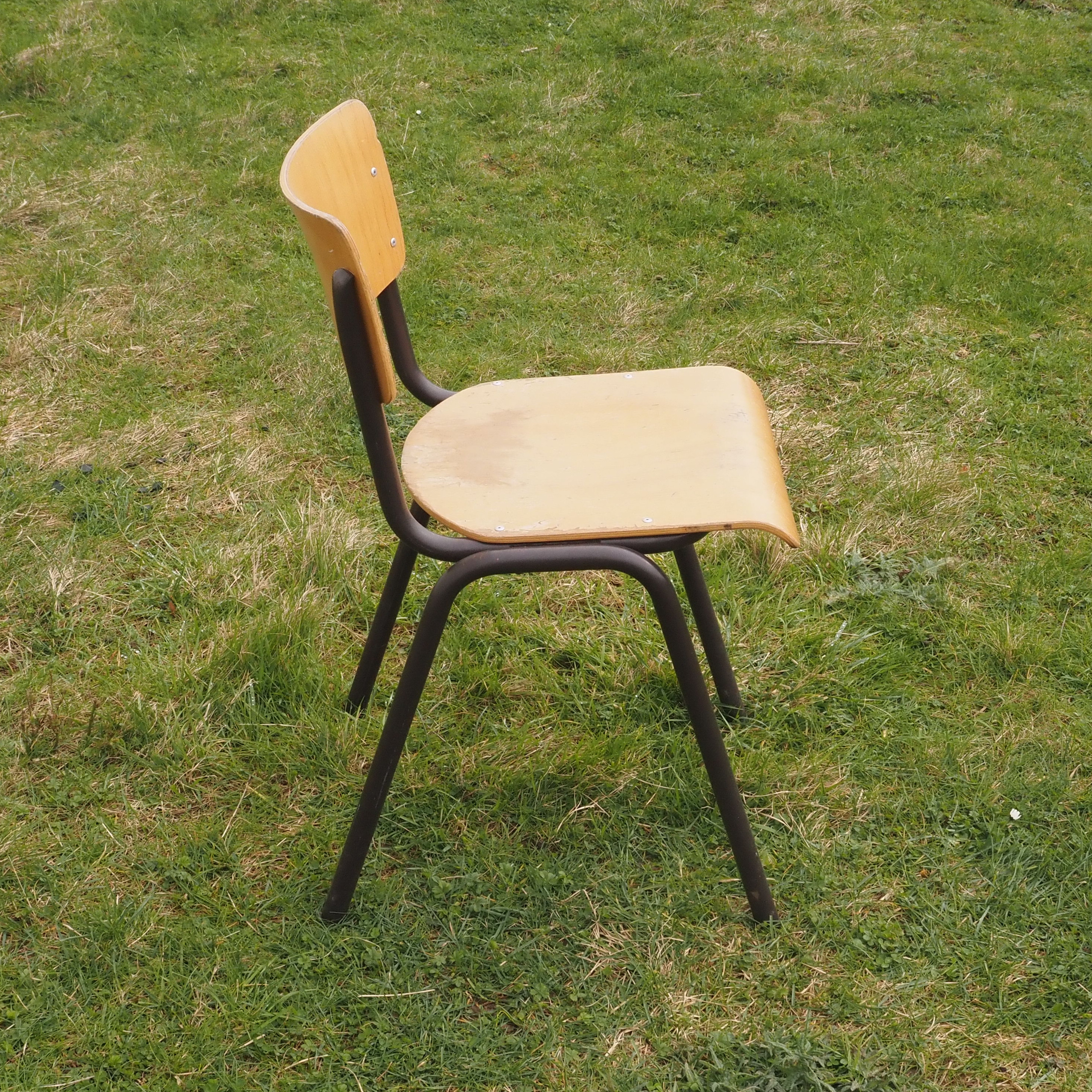 Stackable school chair in plywood and steel tube legs