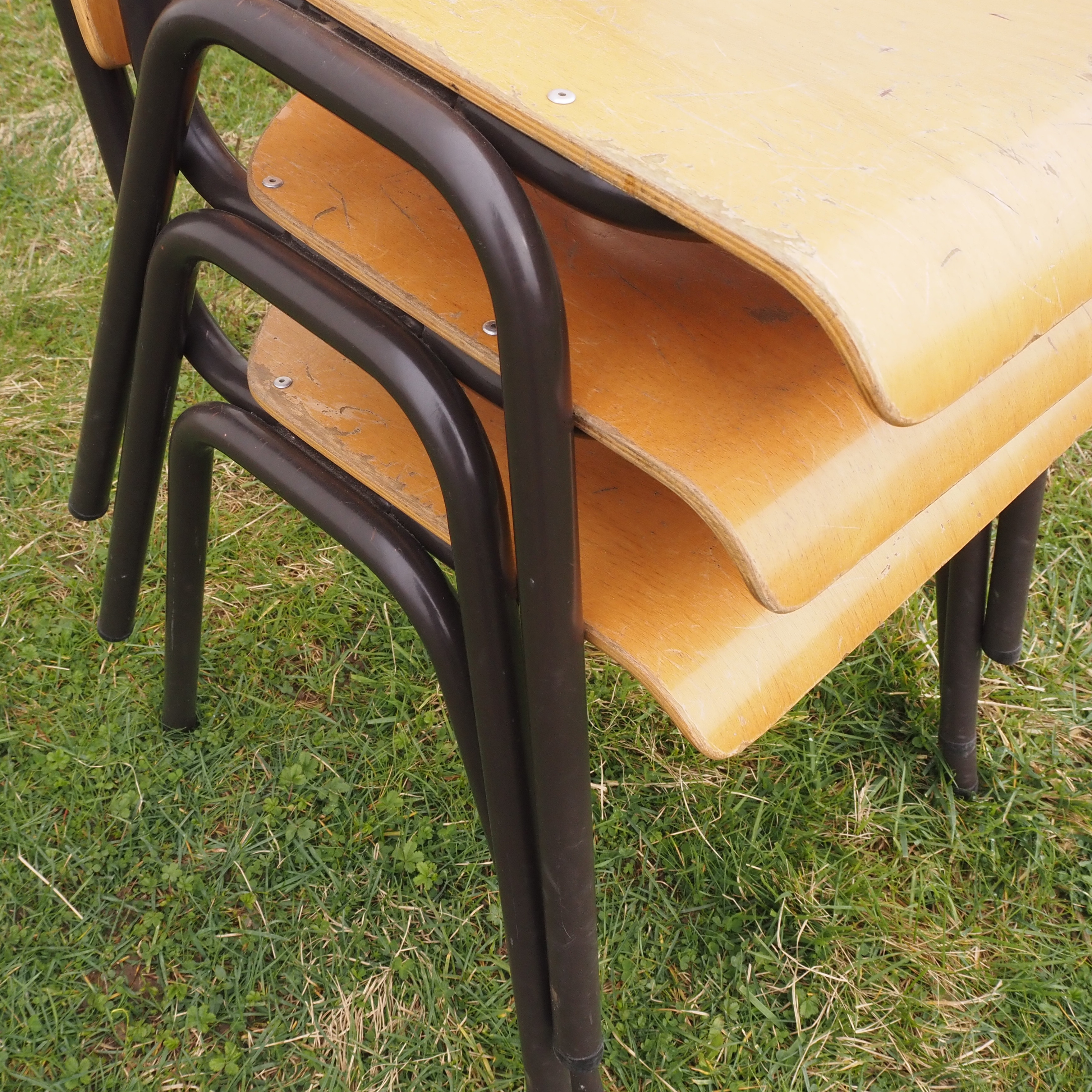 Stackable school chair in plywood and steel tube legs