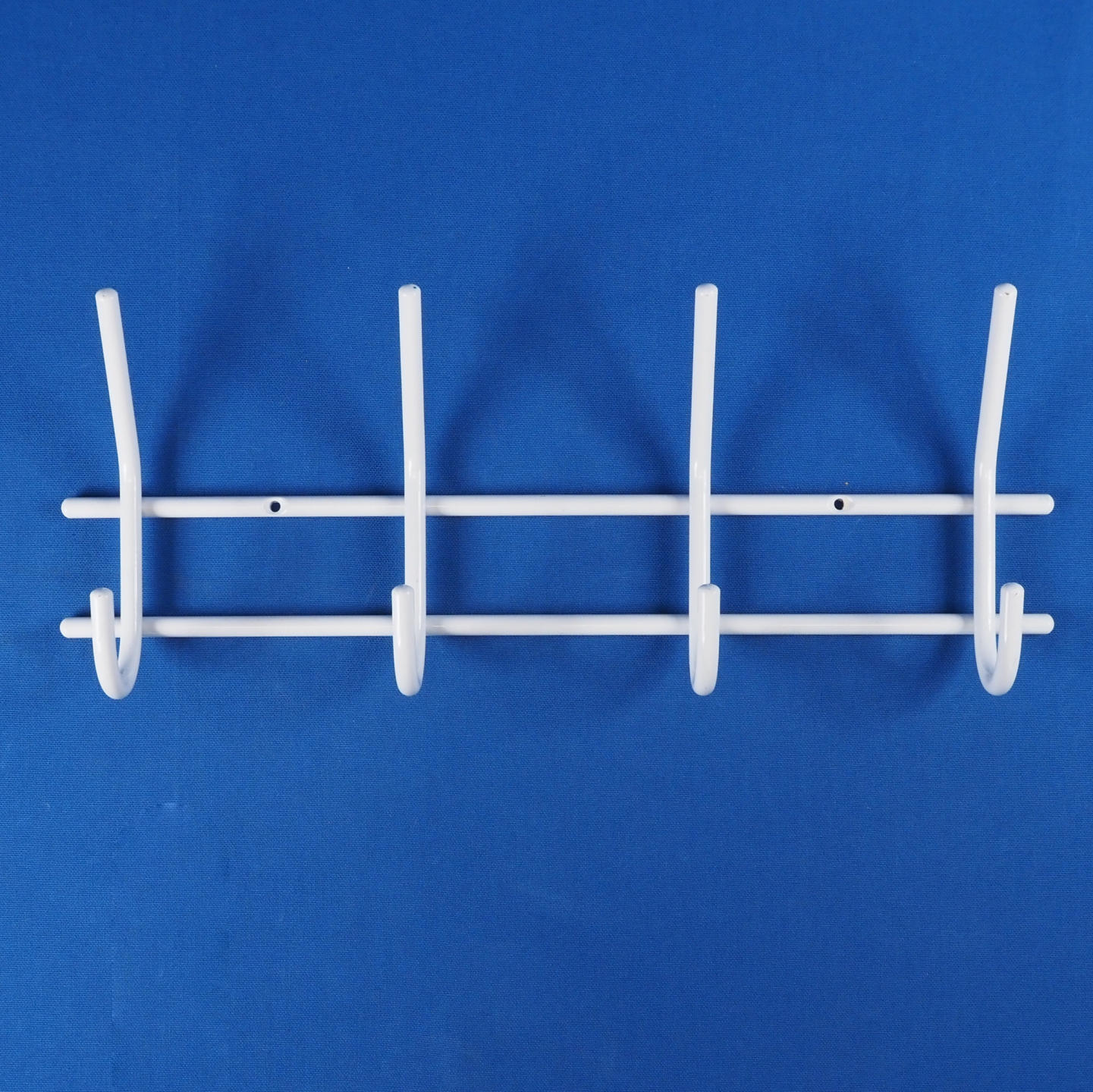 Coat hooks in white lacquered steel by Mack