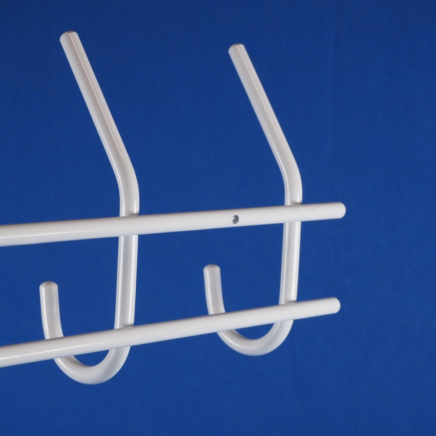 Coat hooks in white lacquered steel by Mack