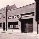 Wall light in opaline glass and bakelite by Bo-Niko (ca. 1960)