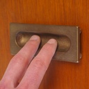 Inset cabinet handle in solid bronze by Jules Wabbes (ca. 1970)