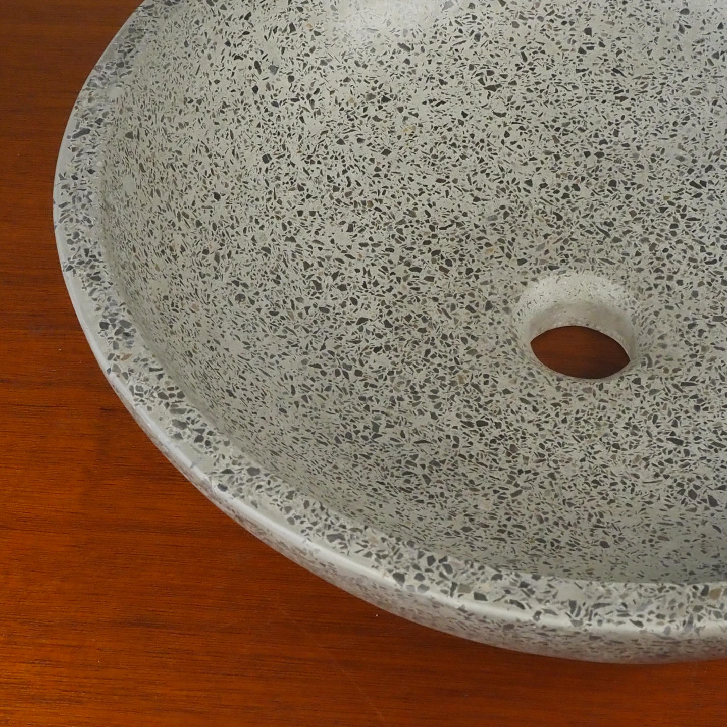 Round bathroom sink in natural stone