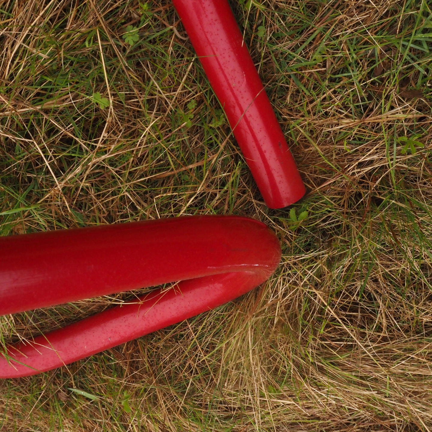 Coat rack in red coated bent steel