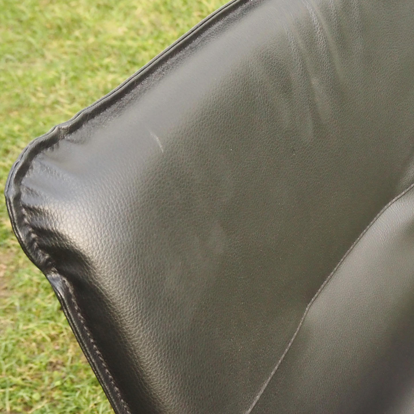 Cantilever armchair in steel and black synthetic leather