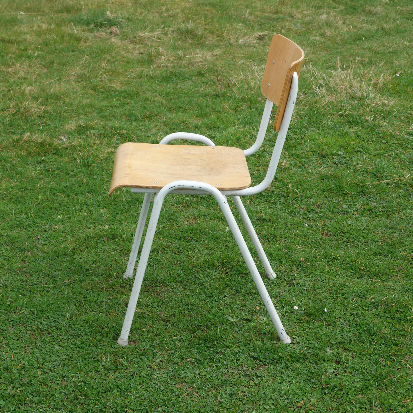 Stackable school chair with chromed tubular steel legs