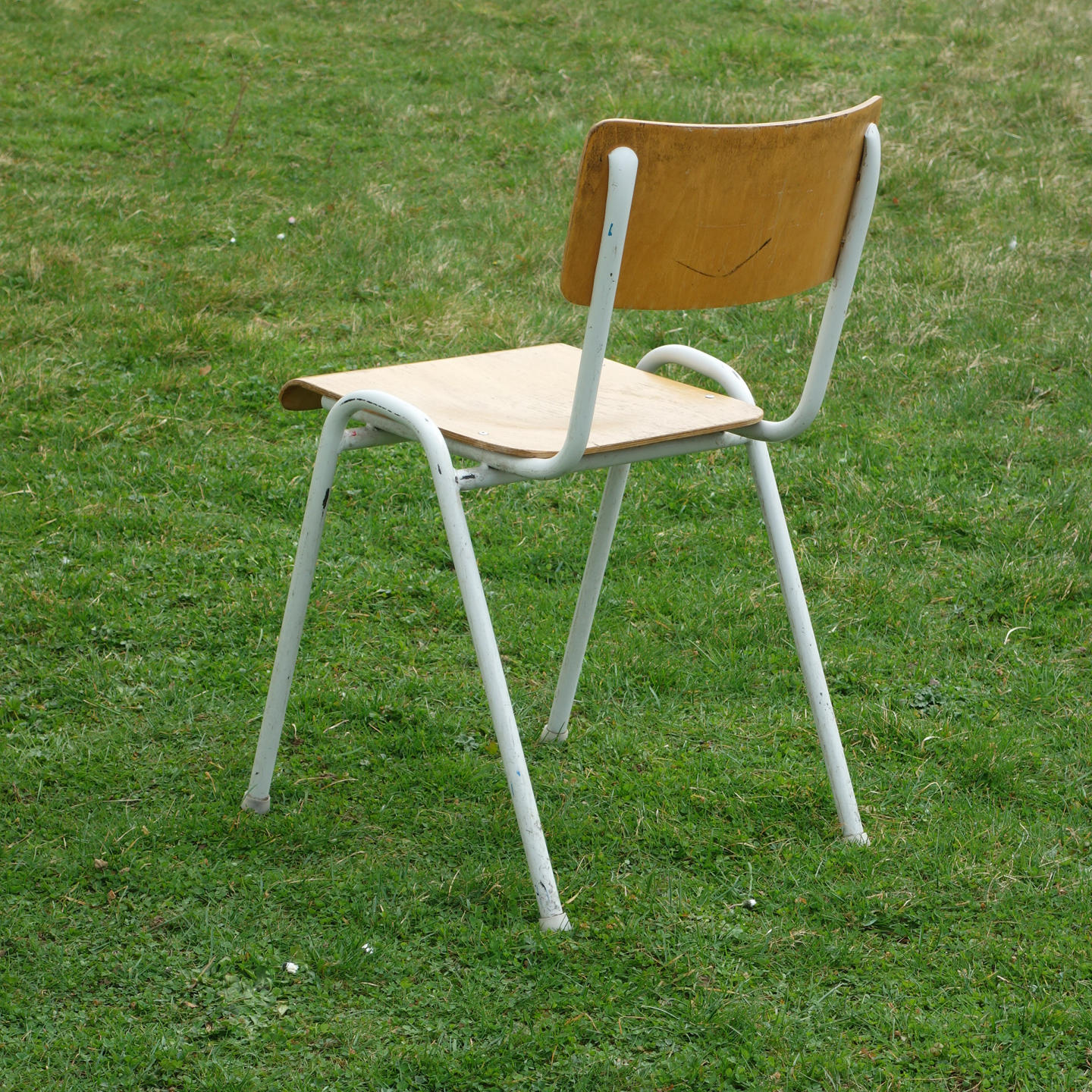 Stackable school chair with chromed tubular steel legs