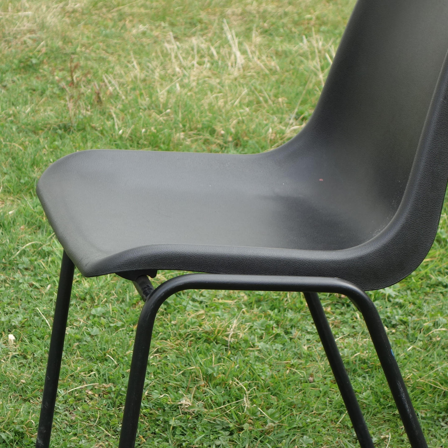 Stackable chair with black polypropylene shell