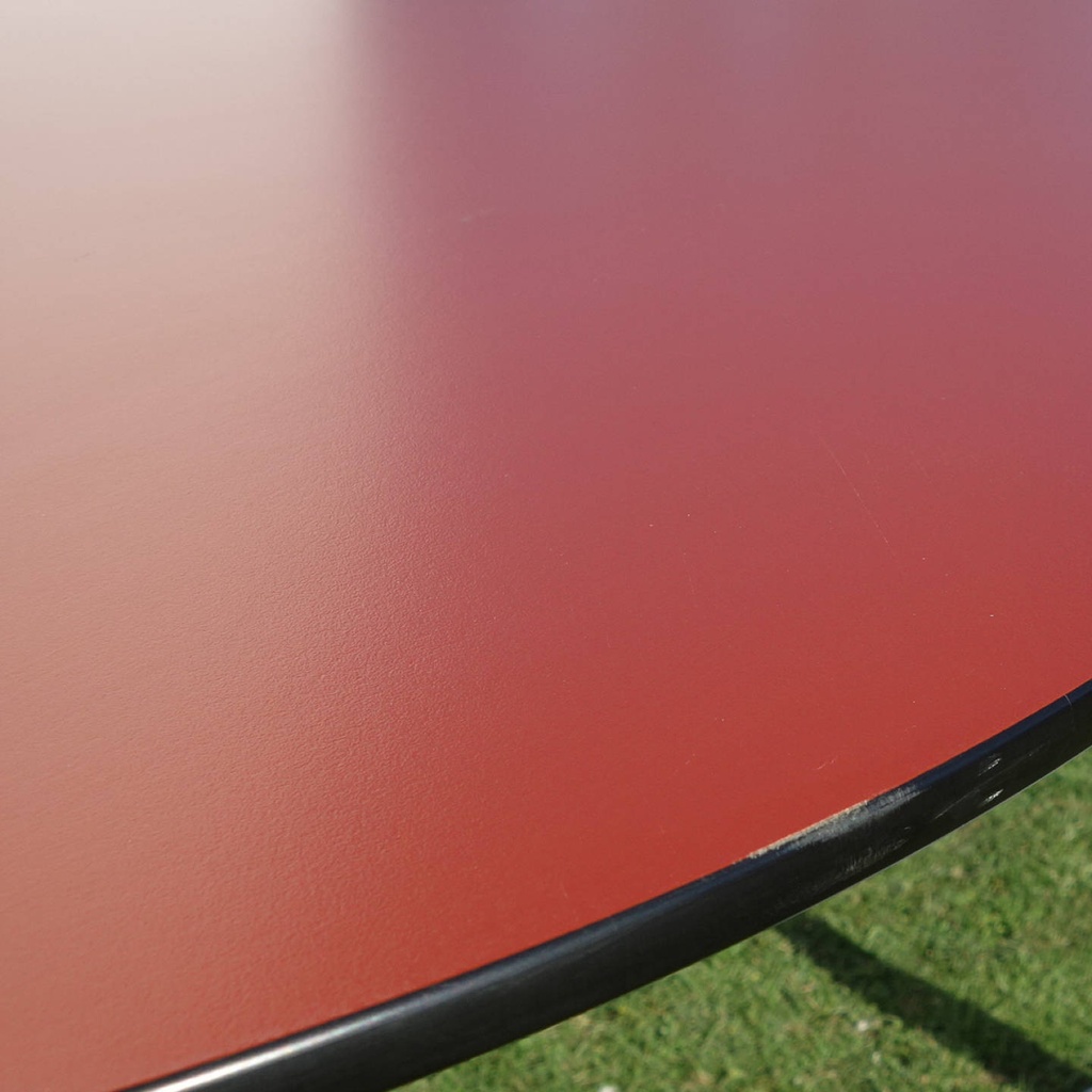 Table with orange laminated tabletop and powder coated steel legs by bene