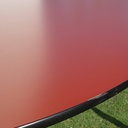 Table with orange laminated tabletop and powder coated steel legs by bene