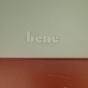 Table with orange laminated tabletop and powder coated steel legs by bene