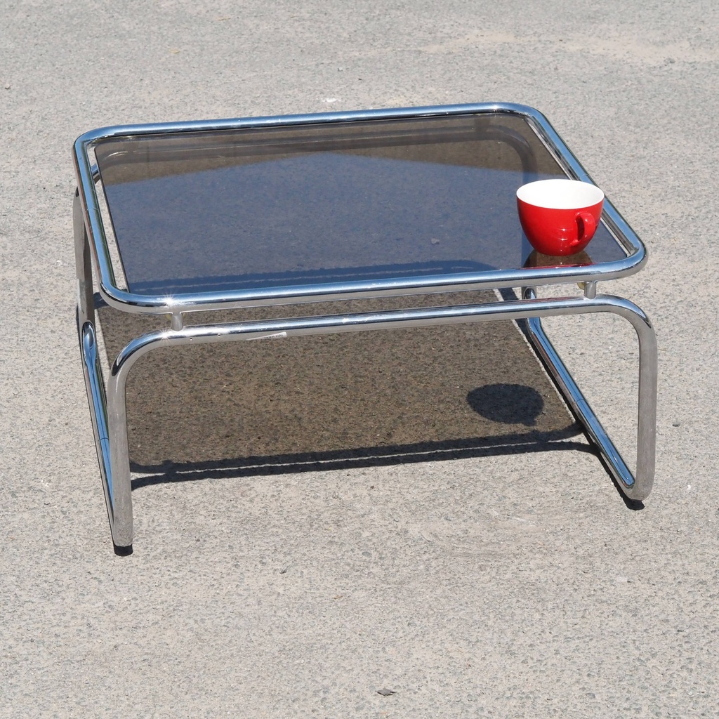 Coffee table with smoked tempered glass top and tubular chromed steel base