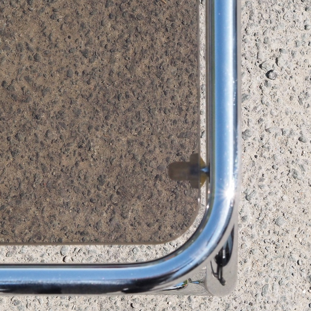 Coffee table with smoked tempered glass top and tubular chromed steel base