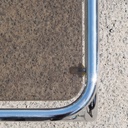 Coffee table with smoked tempered glass top and tubular chromed steel base