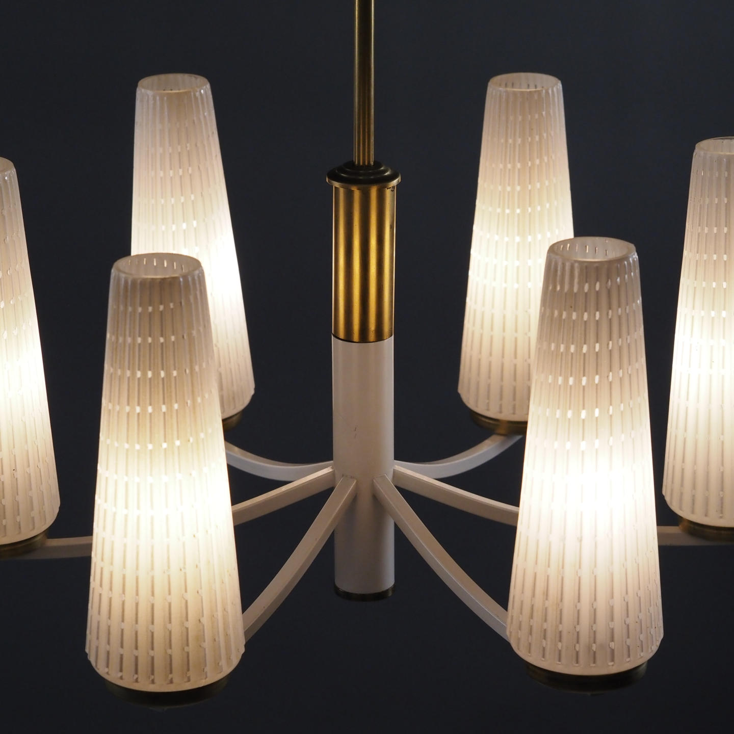Chandelier in brass with textured glass shades
