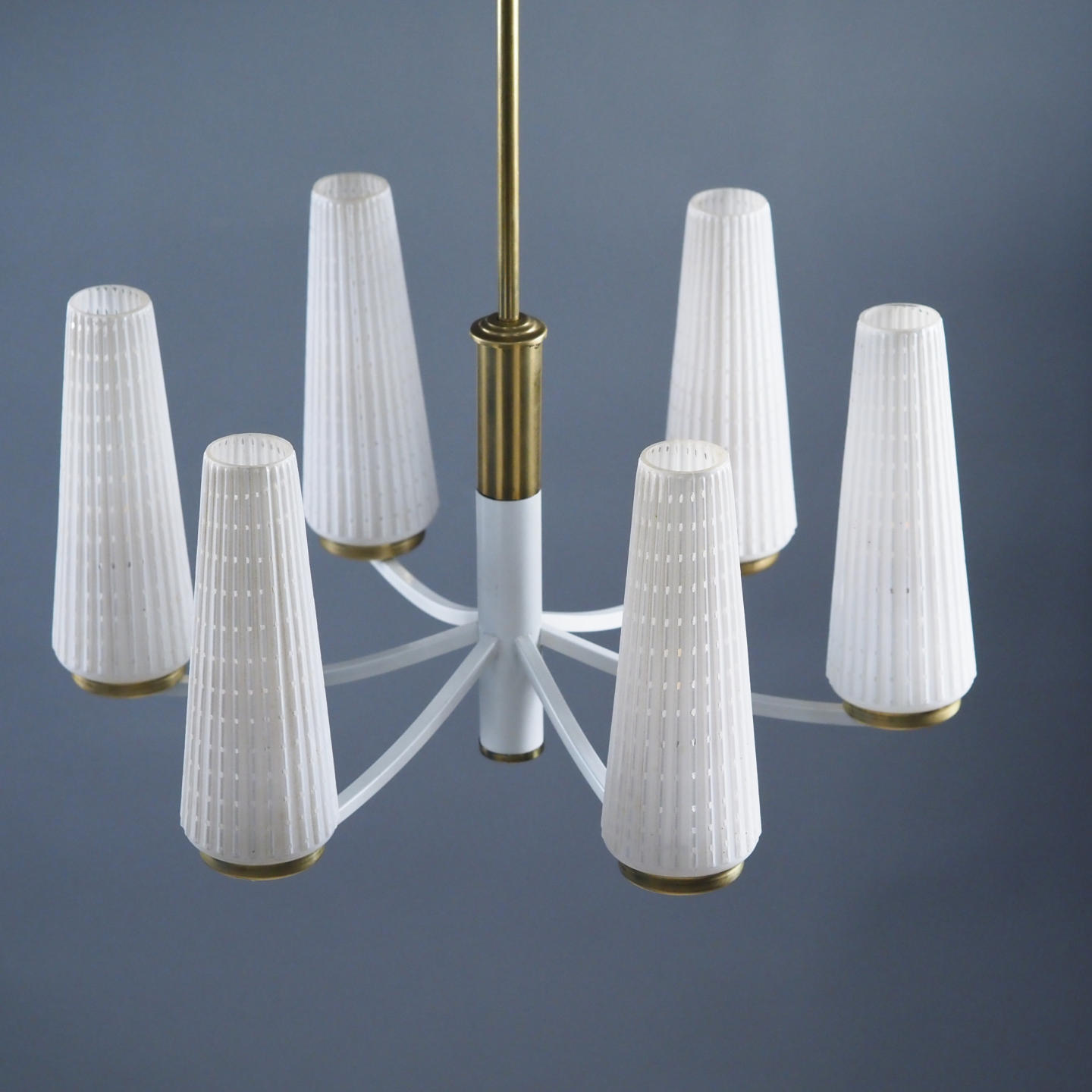 Chandelier in brass with textured glass shades