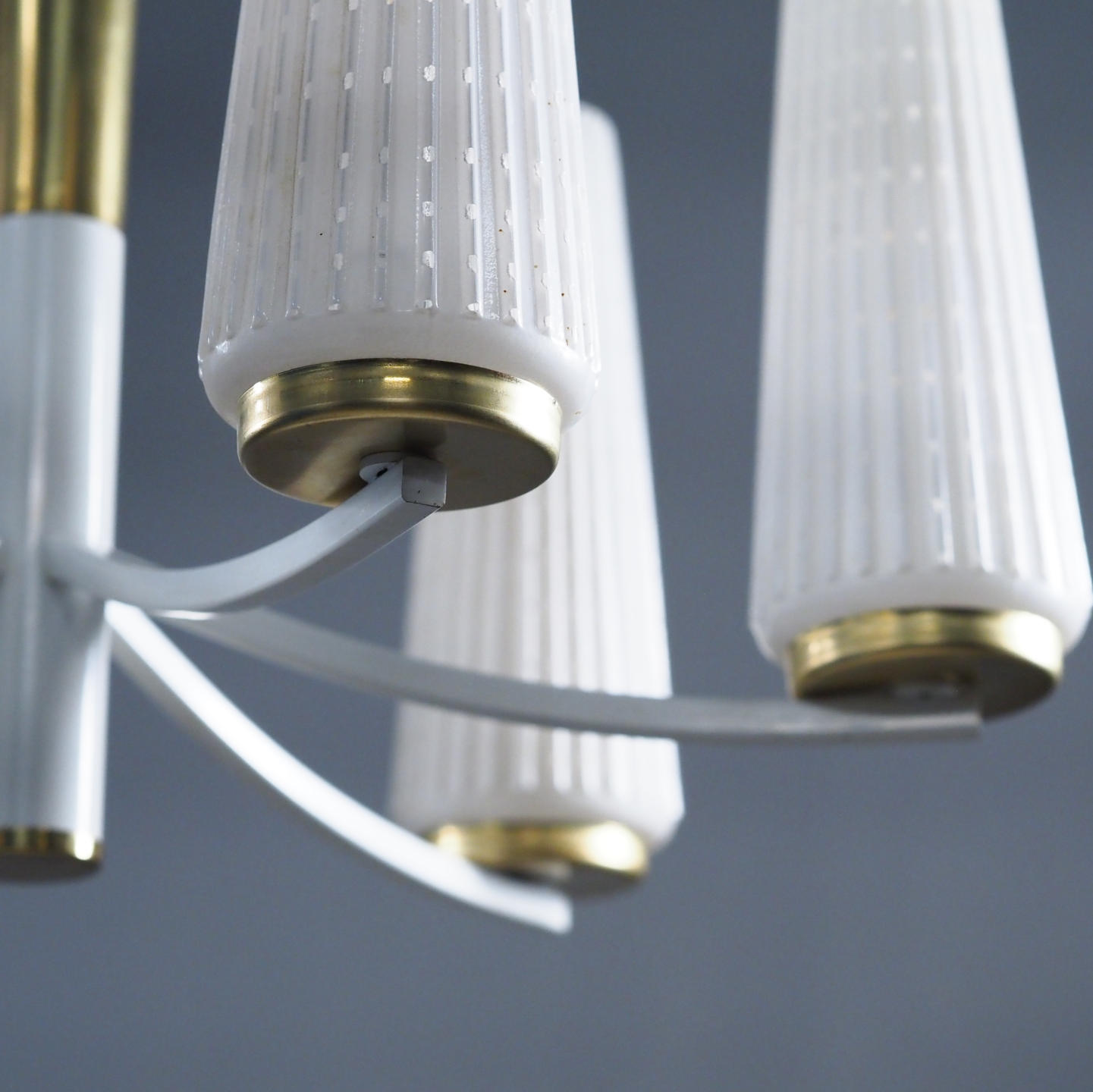 Chandelier in brass with textured glass shades