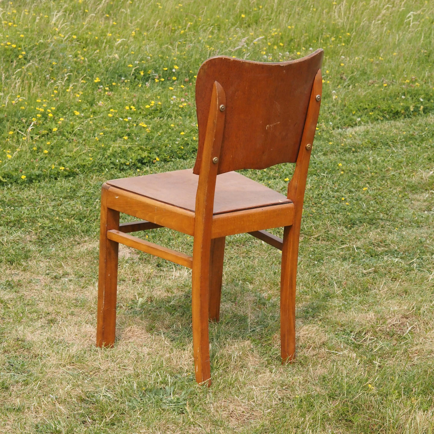 Chair in varnished oak (ca. 1960)