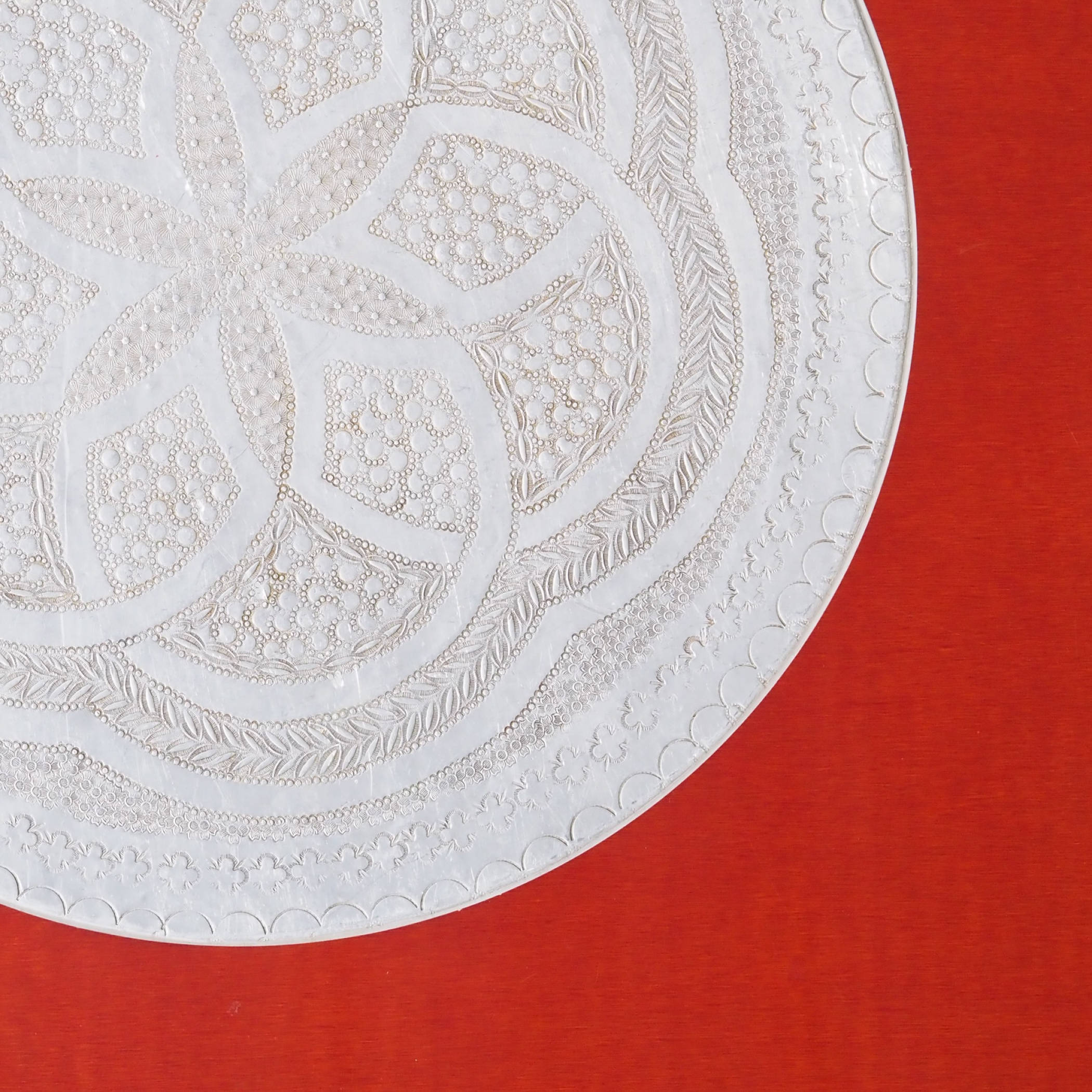 Large tabletop in laminated plywood with etched metallic ornaments