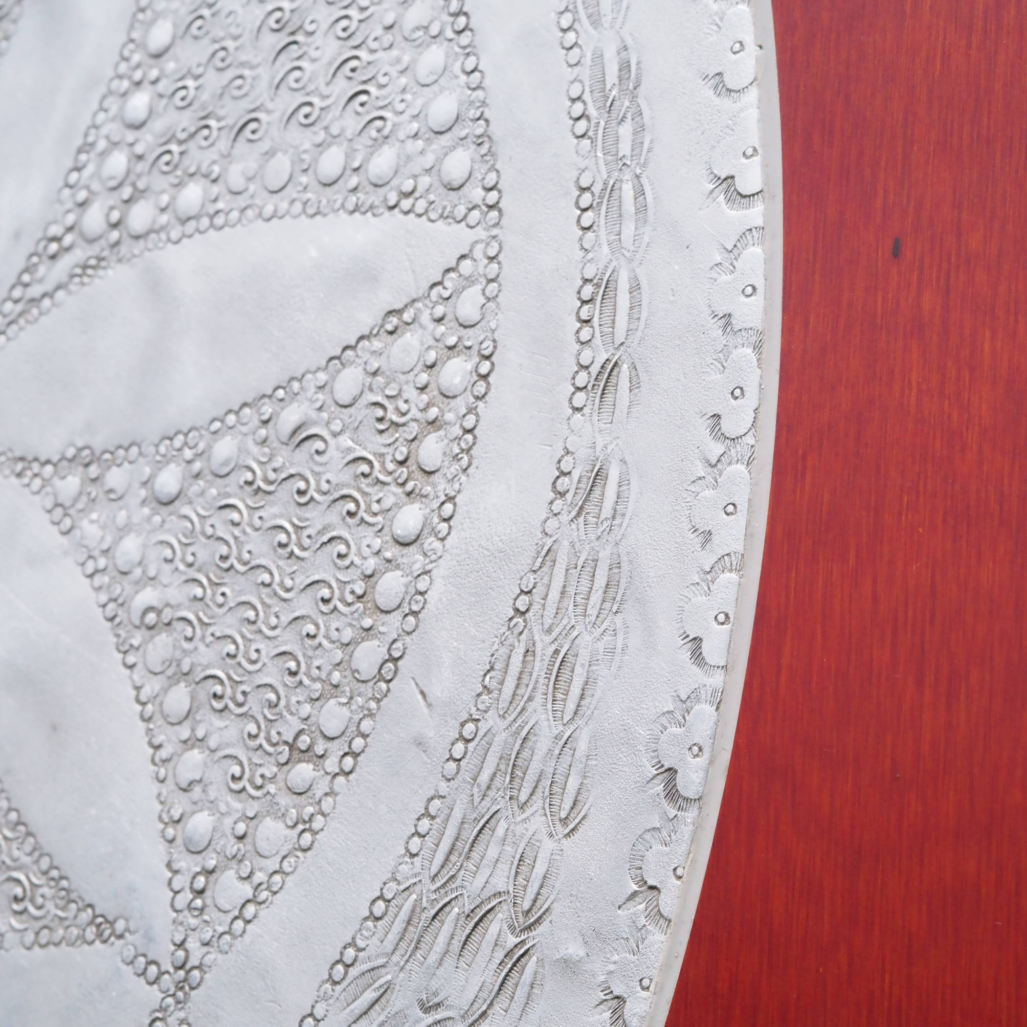 Large tabletop in laminated plywood with etched metallic ornaments
