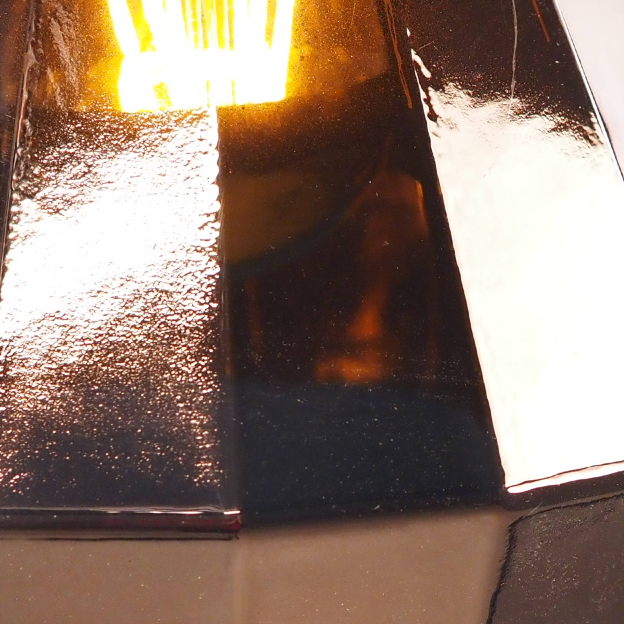 Hanging light in glass with copper finish by Utilicht