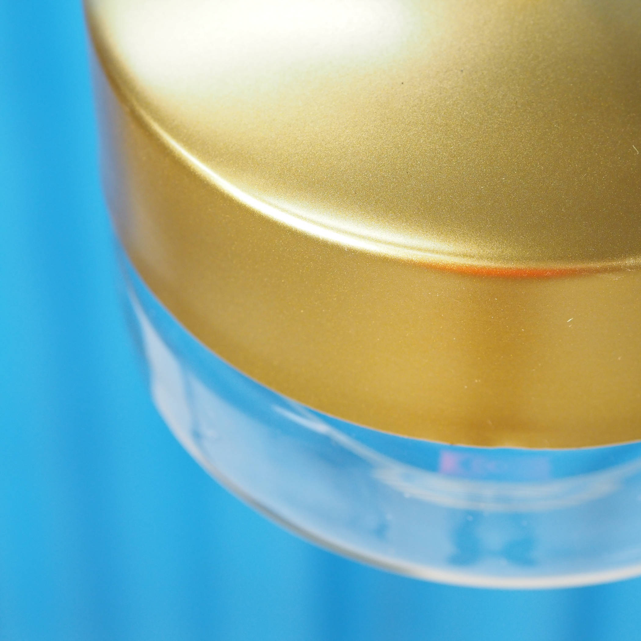 Hanging light in gold plated steel with glass diffuser by Utilicht (⌀ 24,5 cm)