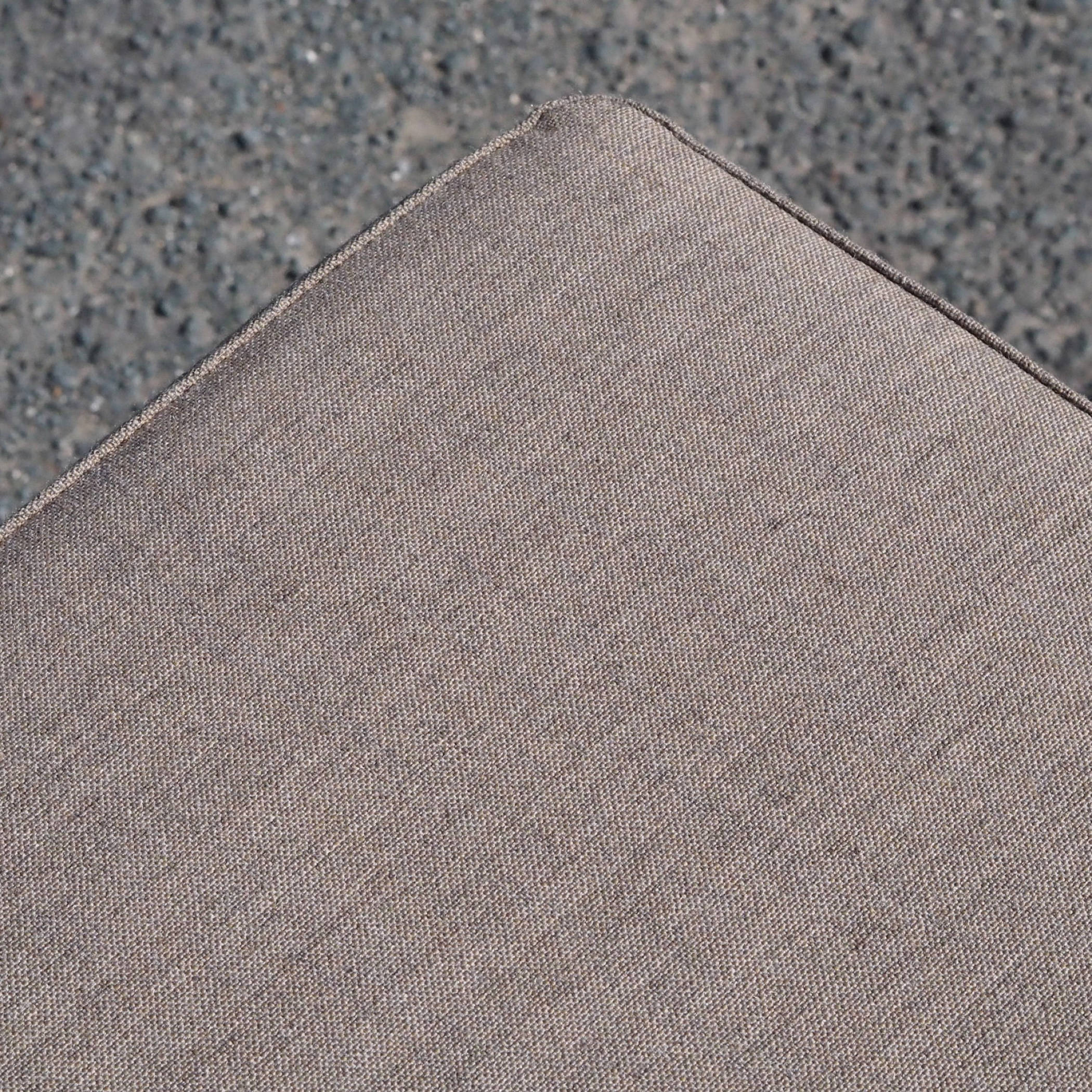 Square ottoman upholstered in grey or blue fabric