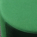 Round ottoman upholstered in various colorful fabric