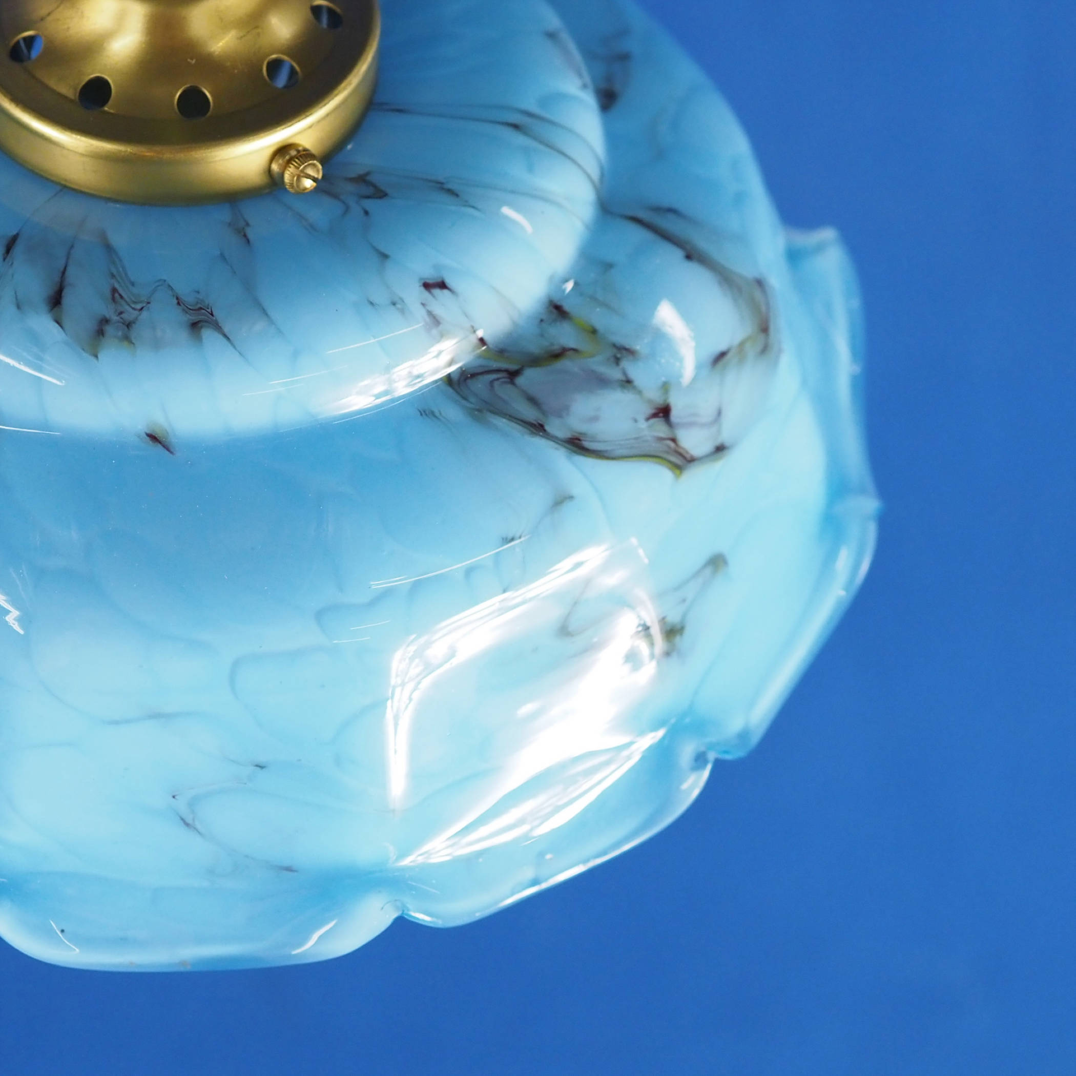 Hanging light with blue glass diffuser