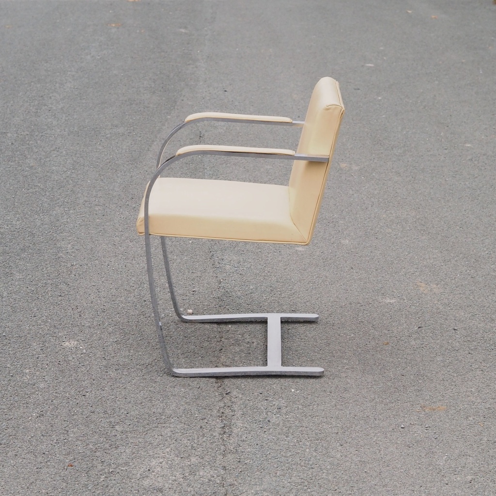 Armchair in chromed steel and synthetic leather