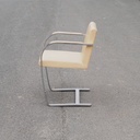 Armchair in chromed steel and synthetic leather