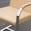 Armchair in chromed steel and synthetic leather