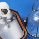 Caged wall/ceiling light with bakelite base, steel cage and textured glass diffuser