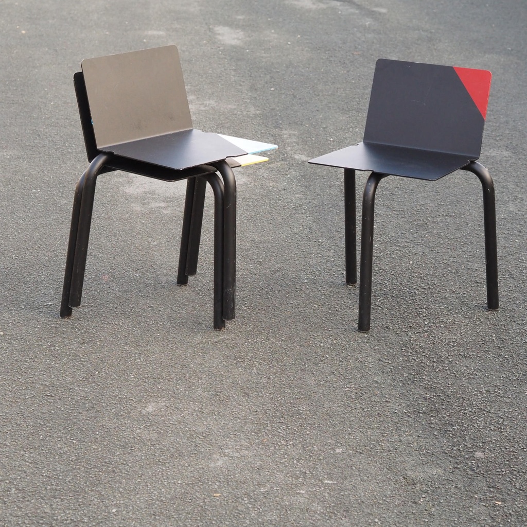 Black stackable chair by Pierre-Emmanuel Vandeputte (with various coloured corners)