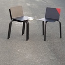 Black stackable chair by Pierre-Emmanuel Vandeputte (with various coloured corners)