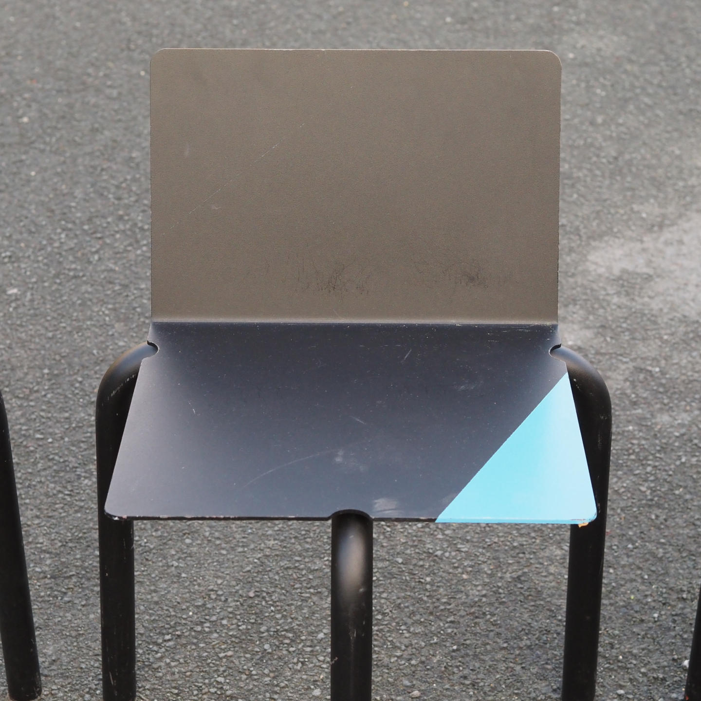 Black stackable chair by Pierre-Emmanuel Vandeputte (with various coloured corners)