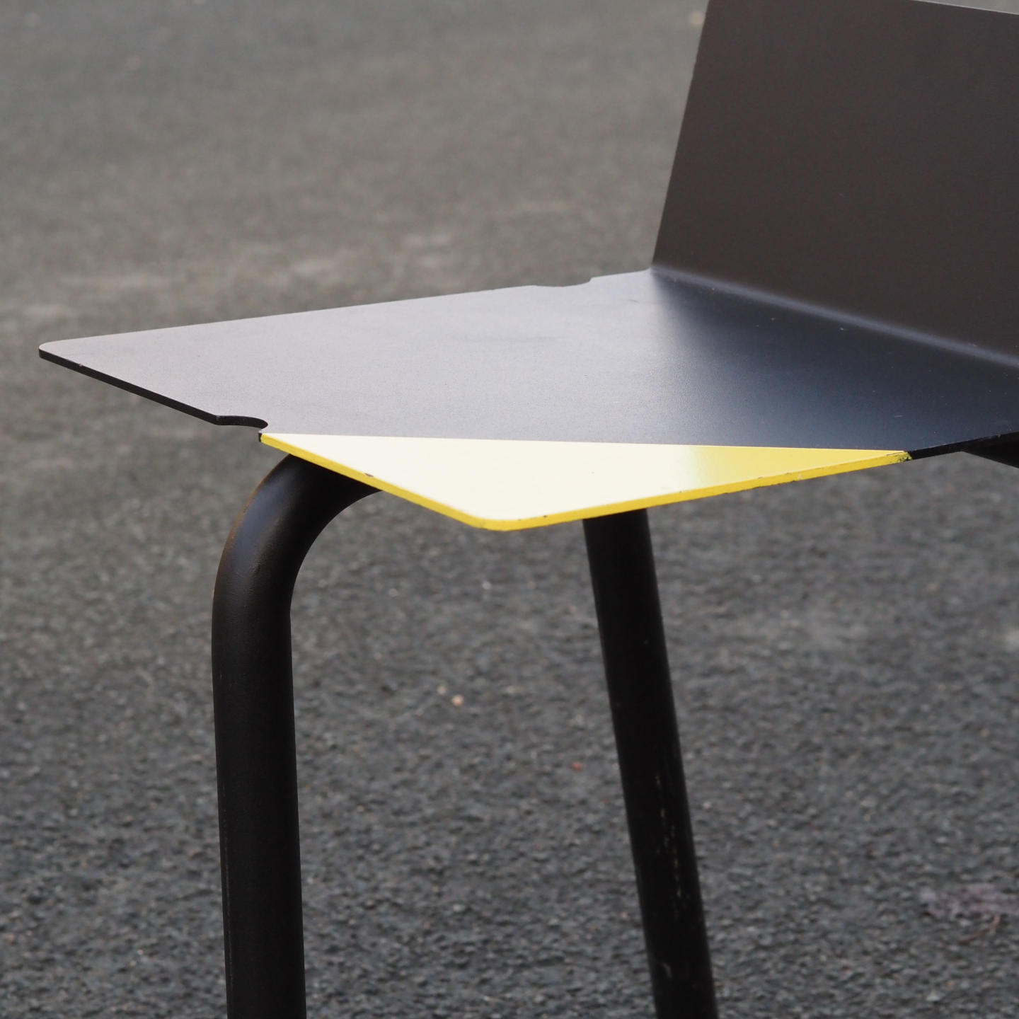 Black stackable chair by Pierre-Emmanuel Vandeputte (with various coloured corners)