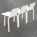 White stackable chair by Pierre-Emmanuel Vandeputte (with various coloured corners)