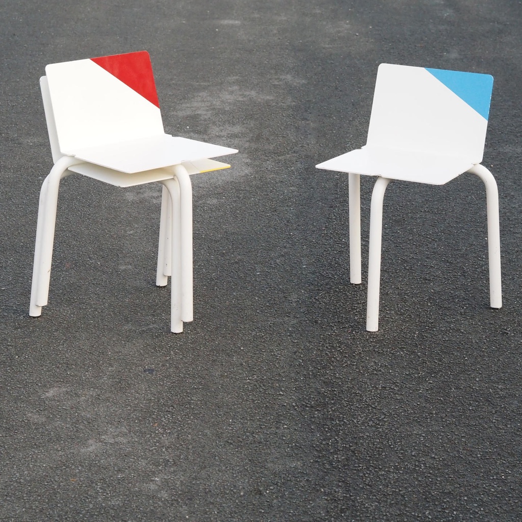 White stackable chair by Pierre-Emmanuel Vandeputte (with various coloured corners)