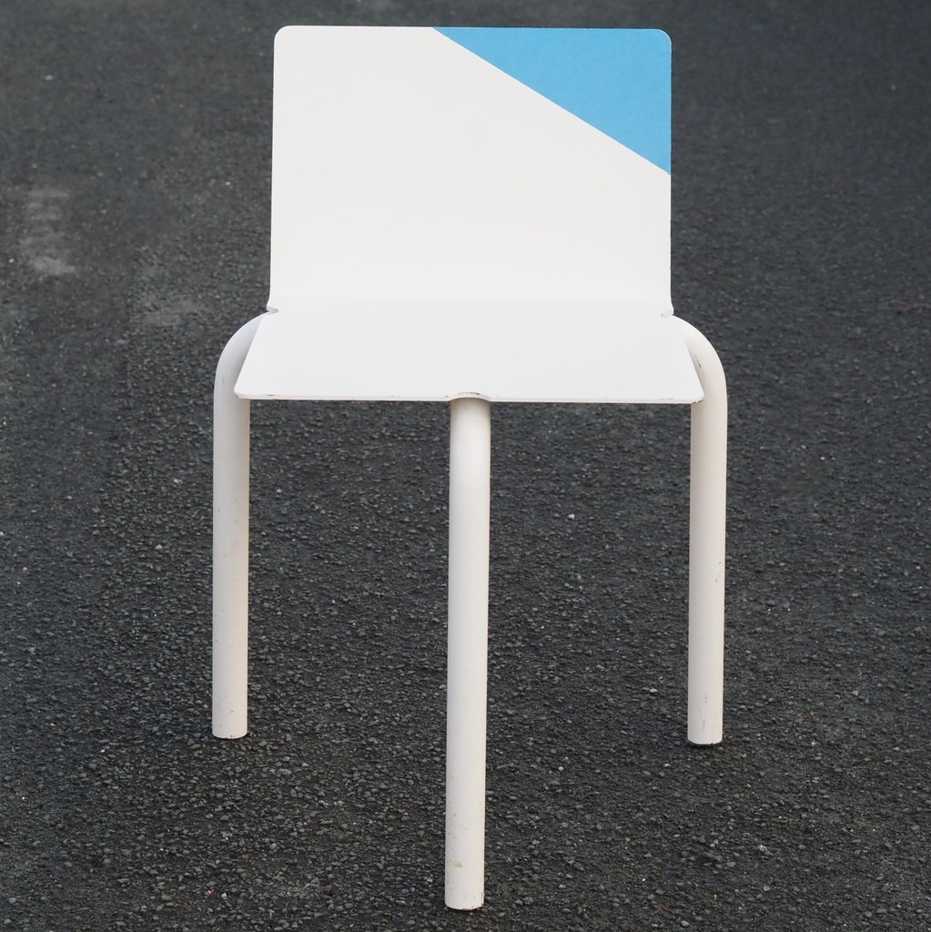 White stackable chair by Pierre-Emmanuel Vandeputte (with various coloured corners)