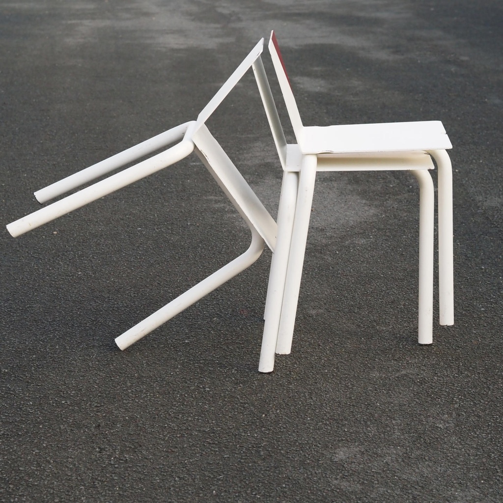 White stackable chair by Pierre-Emmanuel Vandeputte (with various coloured corners)