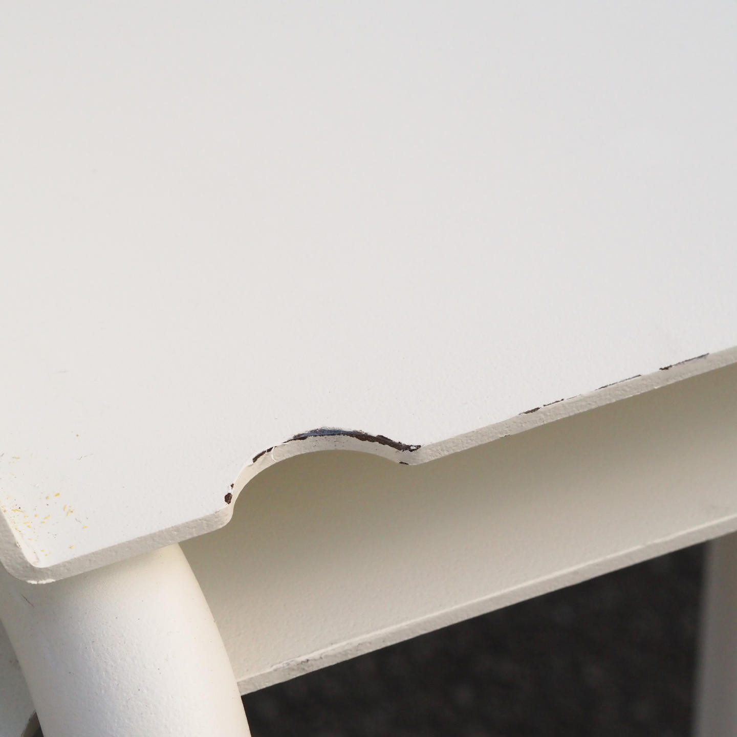 White stackable chair by Pierre-Emmanuel Vandeputte (with various coloured corners)