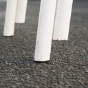 White stackable chair by Pierre-Emmanuel Vandeputte (with various coloured corners)